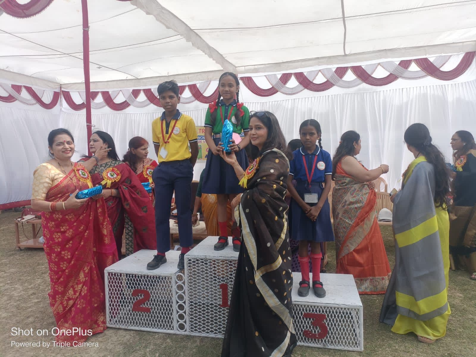 Students on the medal podium at Sports Day